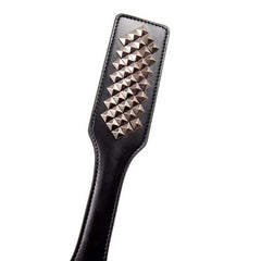 Studded leather bound paddle
