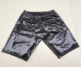 Latex shorts with integrated dick sleeve.