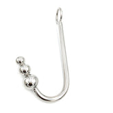 A stainless steel anal hook with a triple ball end, featuring a smooth finish and a rope eyelet for attachment.