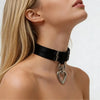 Black choker collar with a heart-shaped rope or leash ring worn by a model for BDSM and bondage sex play