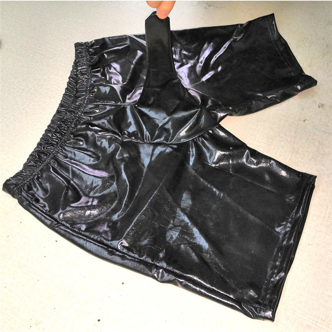 Latex shorts with integrated dick sleeve.