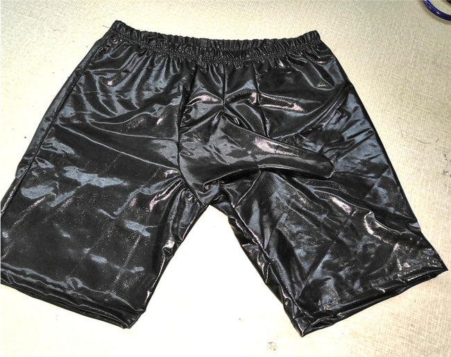 Latex shorts with integrated dick sleeve.