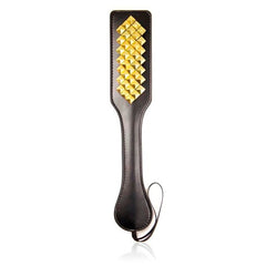 Studded leather bound paddle